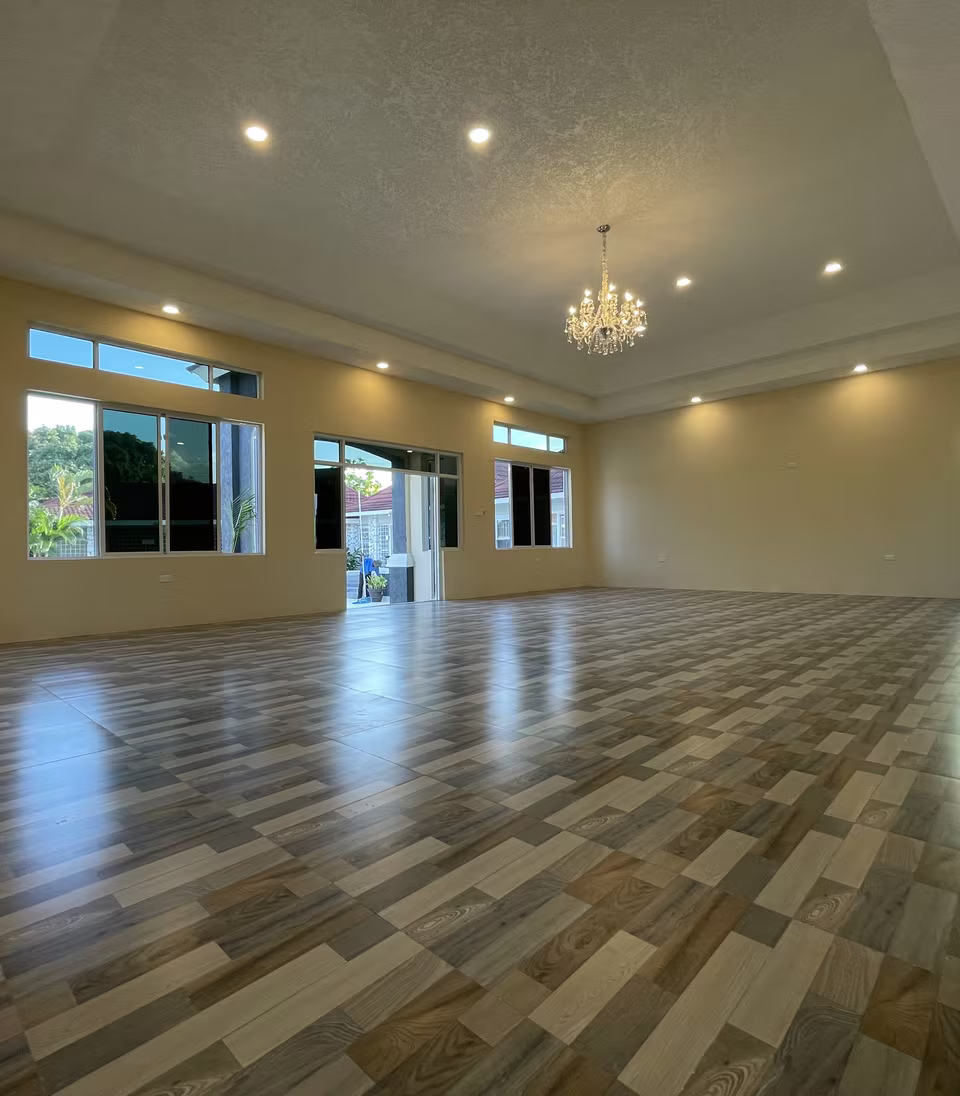 The full length of the ballroom, laid out for over 100 guests